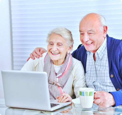 senior couple using laptop